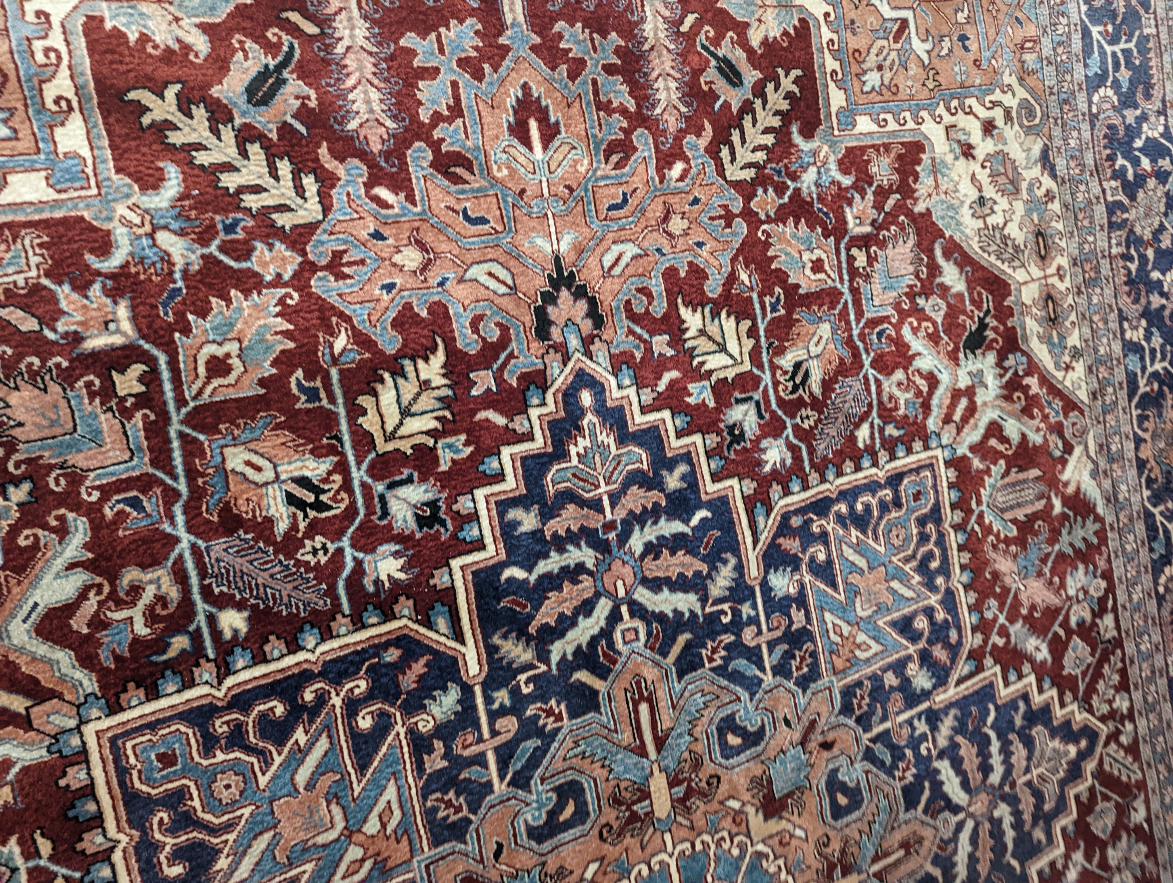 A large Caucasian style red ground carpet, 460 x 330cm